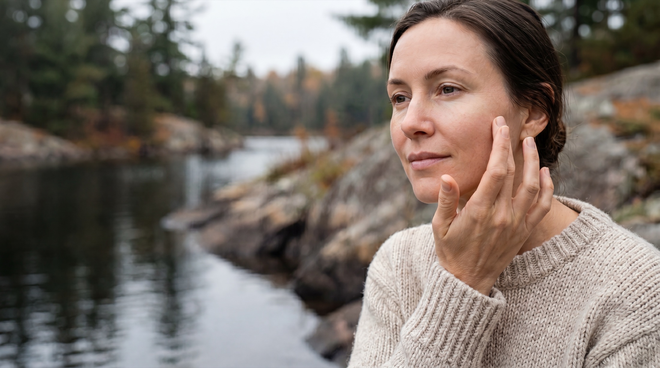 Applying North Channel tallow crème by the water in Northern Ontario